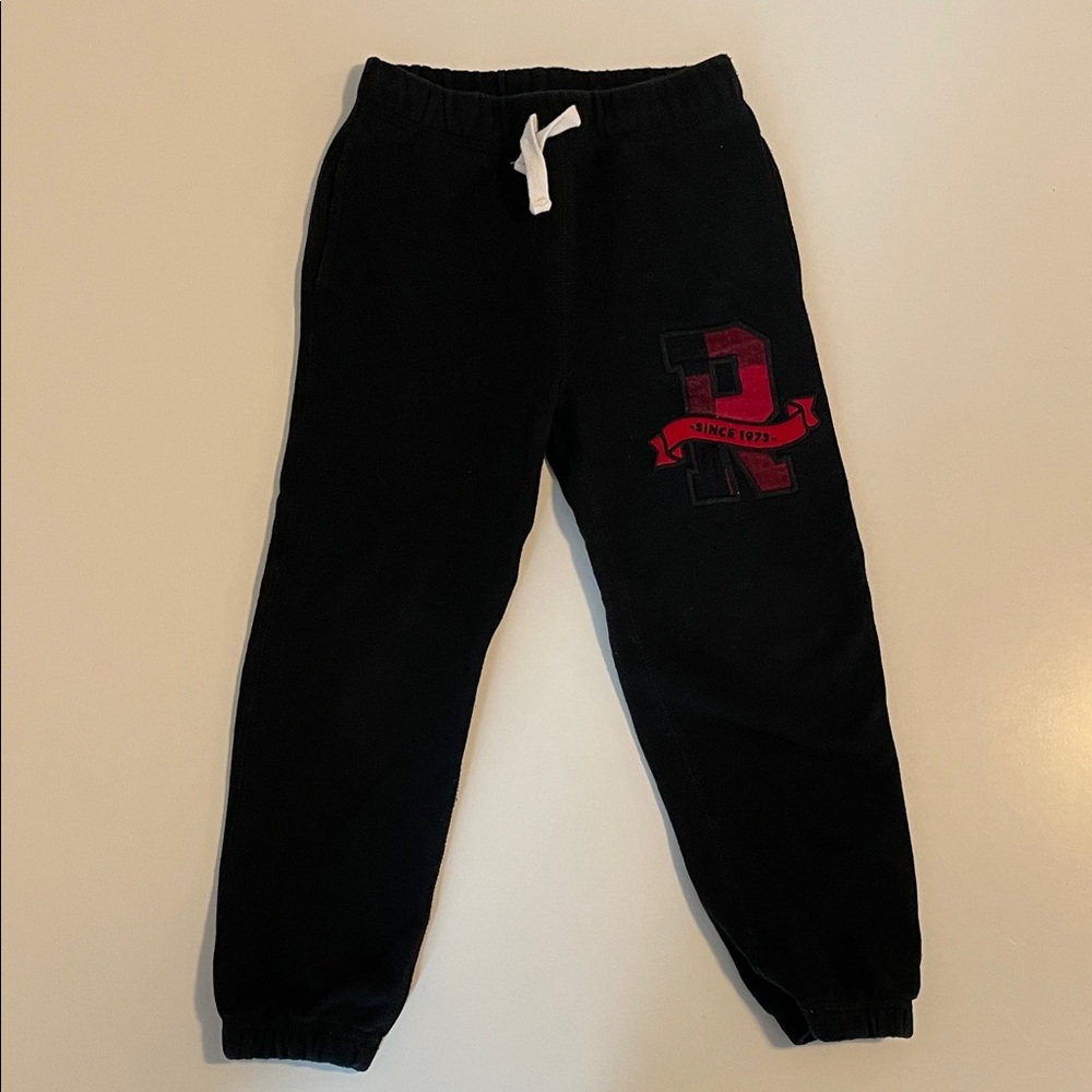 Roots Kids - R logo sweatpants - size 5 - black w/ red buffalo check